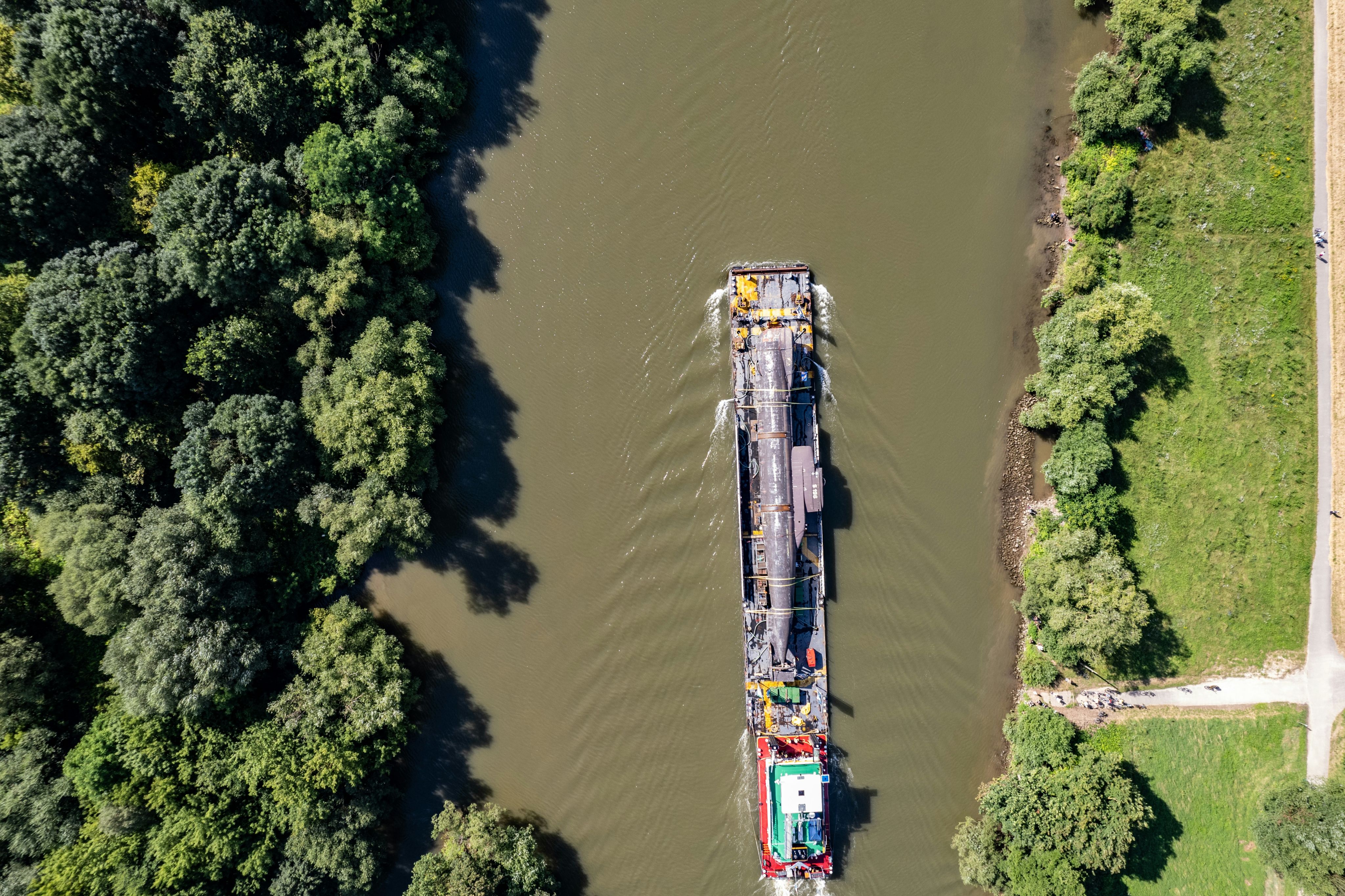 An aerial view of a boat on a river